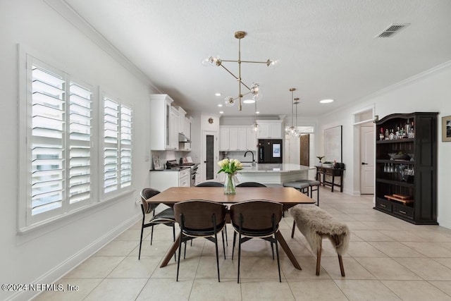 dining room featuring a chandelier, baseboards, light tile patterned floors, and crown molding