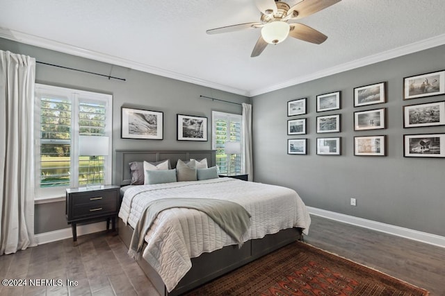 bedroom with ornamental molding, dark wood-type flooring, multiple windows, and ceiling fan