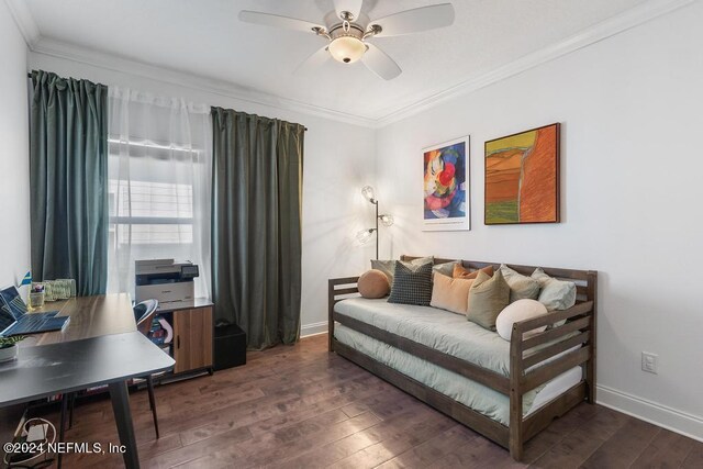 interior space featuring ornamental molding, a ceiling fan, baseboards, and dark wood finished floors