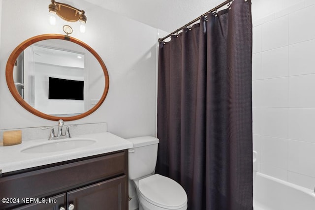 full bathroom with vanity, shower / bath combination with curtain, and toilet