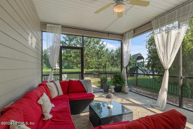 sunroom with ceiling fan and an outdoor living space