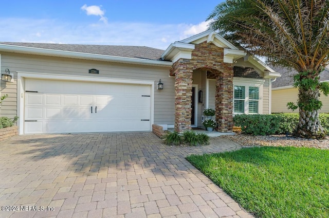 single story home featuring a garage