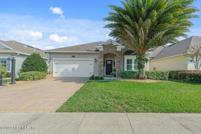 ranch-style house with a front yard and a garage