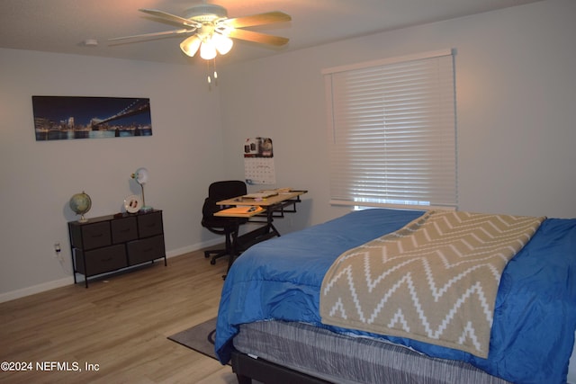 bedroom featuring wood-type flooring and ceiling fan