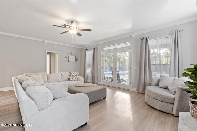 living room featuring french doors, ceiling fan, ornamental molding, and light hardwood / wood-style floors