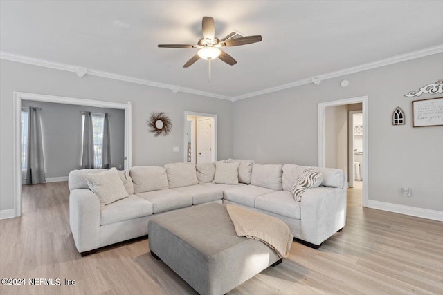 living room with crown molding, light hardwood / wood-style floors, and ceiling fan