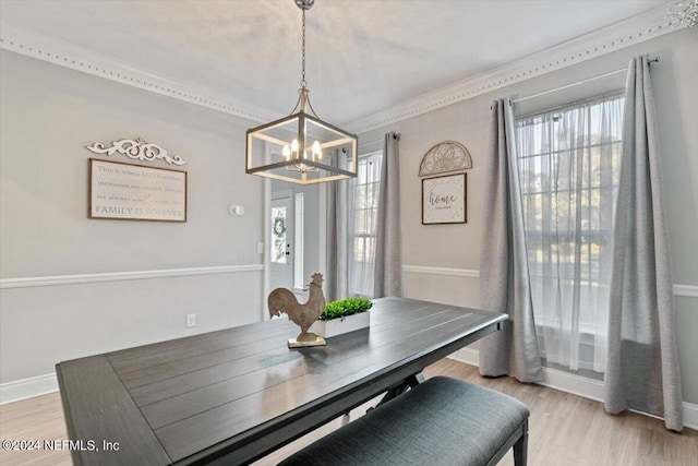 dining room featuring a chandelier and light hardwood / wood-style flooring