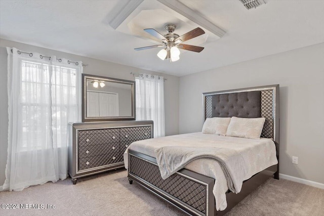 bedroom featuring light colored carpet and ceiling fan