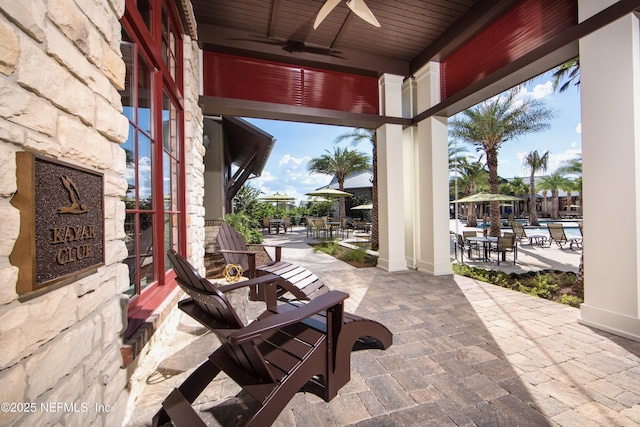 view of patio featuring ceiling fan