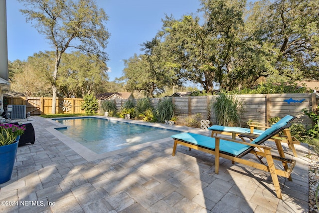 view of pool featuring central AC and a patio area