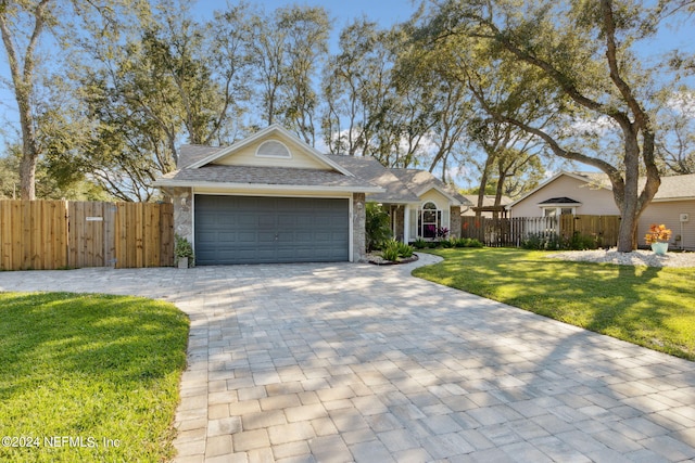 single story home with a front lawn and a garage