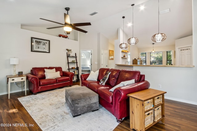 living room featuring ceiling fan, vaulted ceiling, and dark hardwood / wood-style flooring