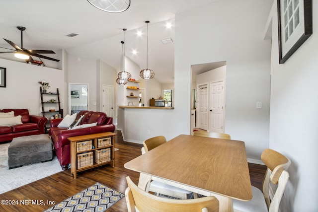 dining room featuring high vaulted ceiling, dark wood-type flooring, and ceiling fan