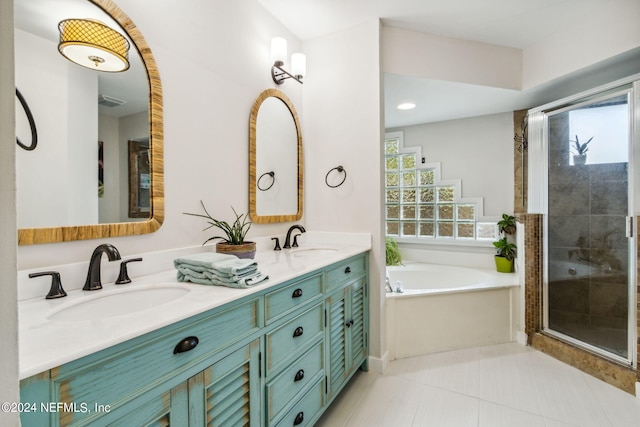 bathroom with a wealth of natural light, vanity, independent shower and bath, and tile patterned flooring