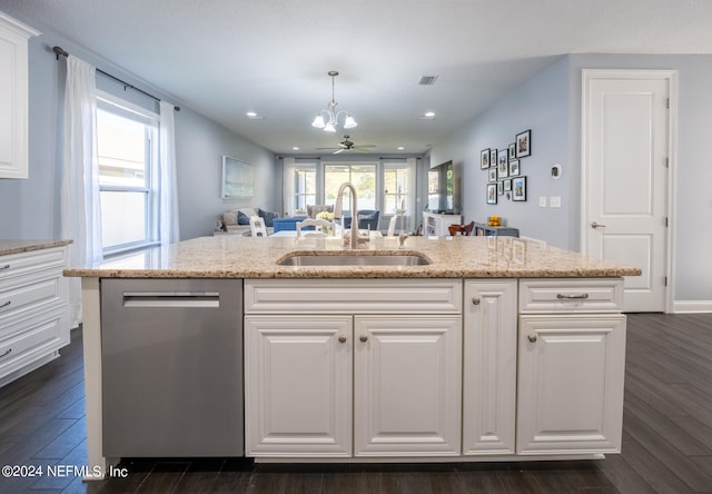 kitchen featuring dishwasher, a kitchen island with sink, sink, ceiling fan, and white cabinetry