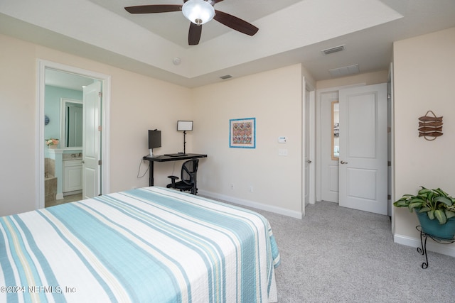 carpeted bedroom featuring connected bathroom and ceiling fan