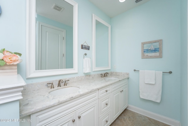 bathroom featuring tile patterned flooring and vanity