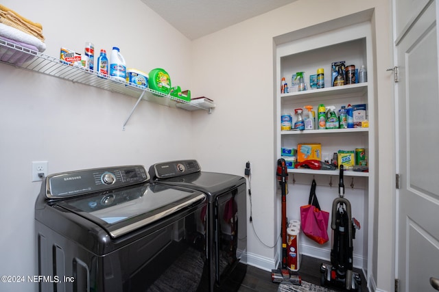 laundry area featuring separate washer and dryer and dark hardwood / wood-style floors