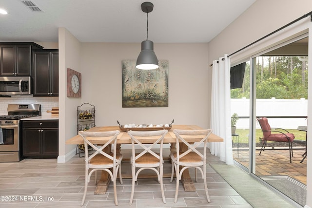 dining space with breakfast area and light hardwood / wood-style floors