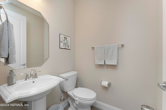 bathroom featuring sink and toilet