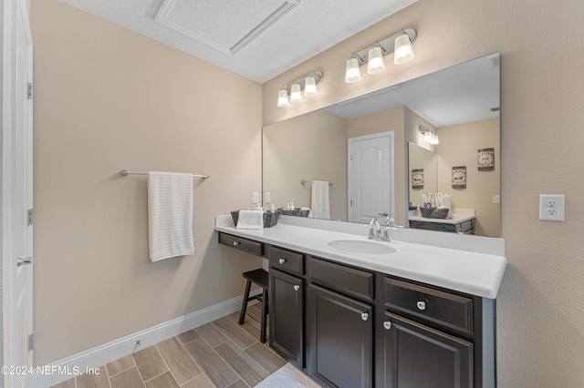 bathroom with vanity and hardwood / wood-style floors