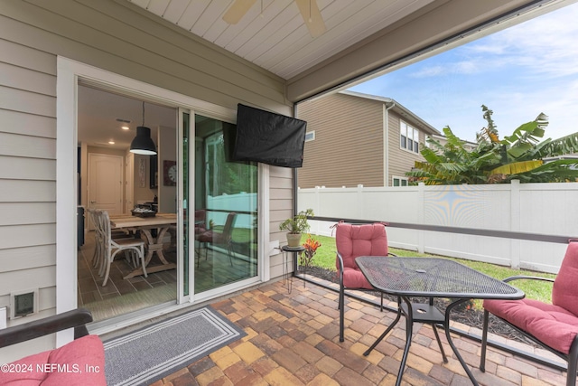 view of patio / terrace featuring ceiling fan