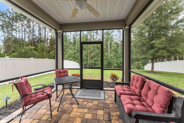 sunroom / solarium with ceiling fan