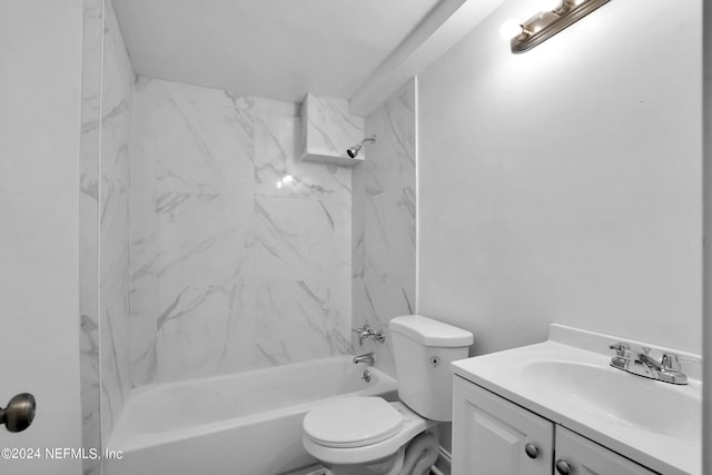 full bathroom featuring vanity, tiled shower / bath combo, and toilet