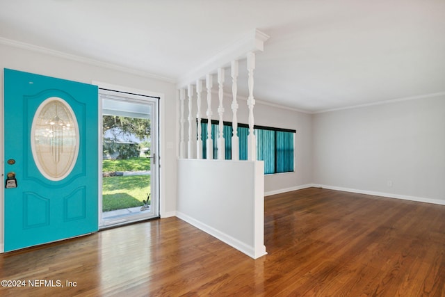 entrance foyer featuring crown molding and hardwood / wood-style flooring