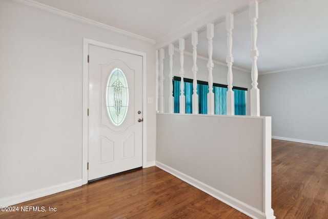 foyer with ornamental molding and hardwood / wood-style floors