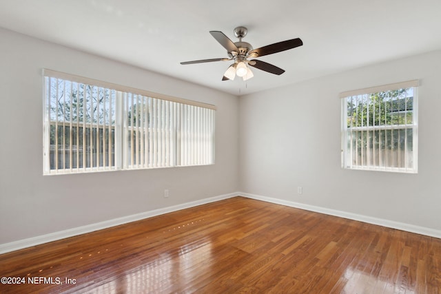 unfurnished room featuring hardwood / wood-style floors and ceiling fan