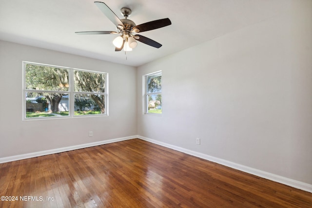 unfurnished room featuring hardwood / wood-style floors and ceiling fan