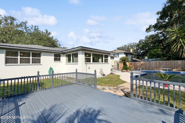 deck with a covered pool