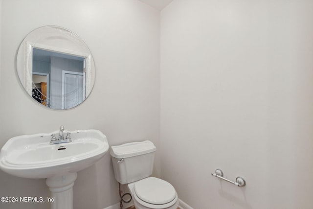 bathroom featuring toilet