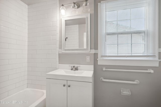 bathroom with vanity and tiled shower / bath combo