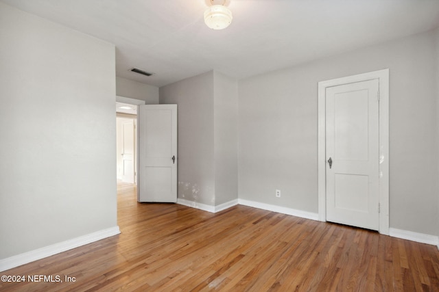 empty room with light hardwood / wood-style floors