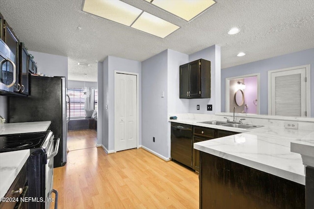 kitchen with a textured ceiling, dishwasher, electric stove, light hardwood / wood-style floors, and sink