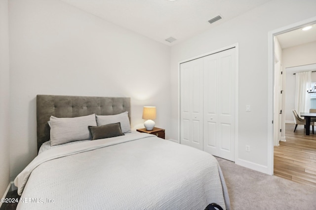 carpeted bedroom featuring a closet