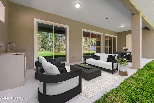 view of patio with sink and an outdoor hangout area