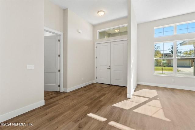 entrance foyer with hardwood / wood-style floors