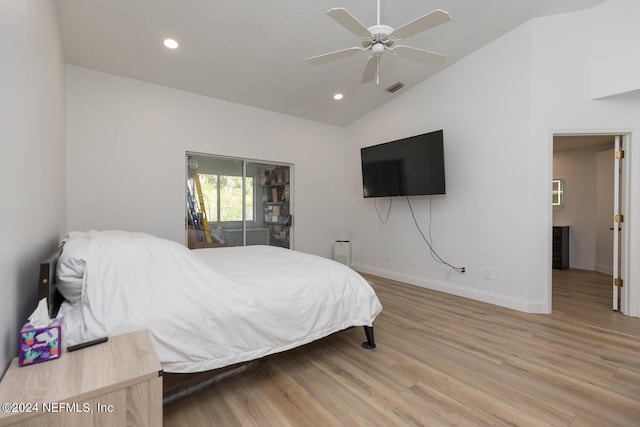 bedroom with ceiling fan, wood-type flooring, and vaulted ceiling