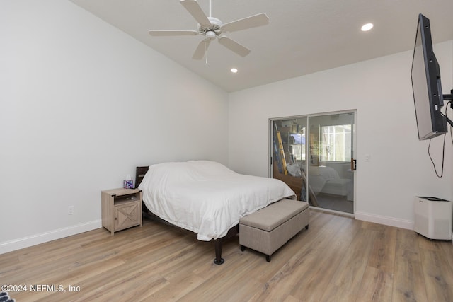 bedroom with light hardwood / wood-style flooring, lofted ceiling, and ceiling fan