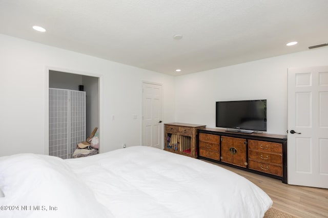 bedroom with light wood-type flooring