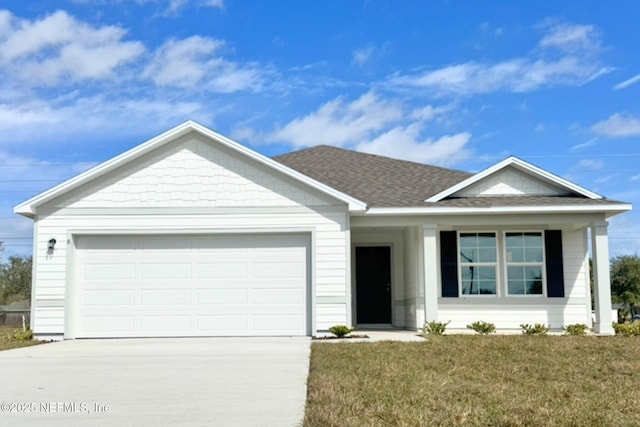 single story home featuring a garage, driveway, a shingled roof, and a front lawn