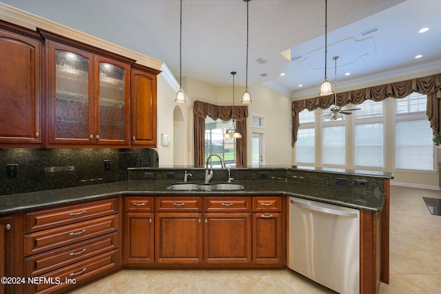 kitchen with ceiling fan, backsplash, dishwasher, pendant lighting, and sink