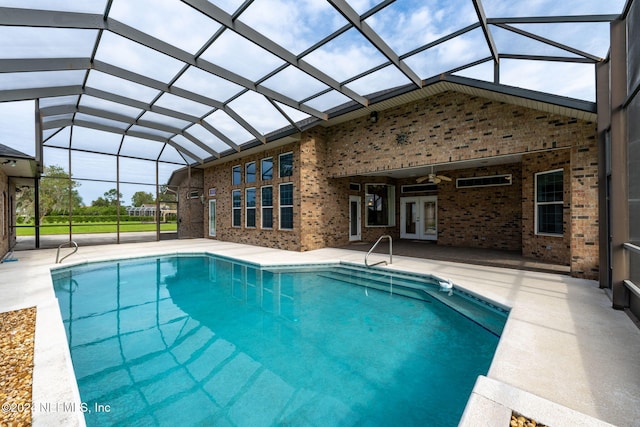 view of pool with a patio area, a lanai, and ceiling fan