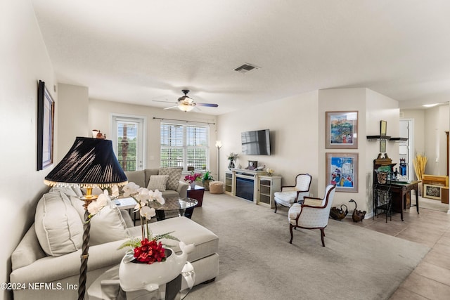 9831 Del Webb Pkwy Unit 2308, Jacksonville, FL 32256 - living area with ceiling fan and tile patterned flooring