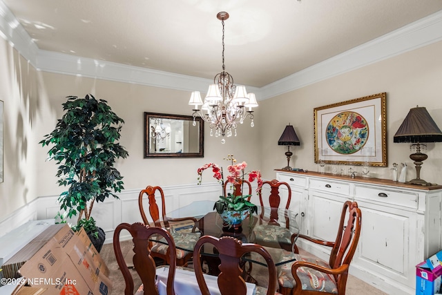 9831 Del Webb Pkwy Unit 2308, Jacksonville, FL 32256 - dining area with ornamental molding, a chandelier, and wainscoting