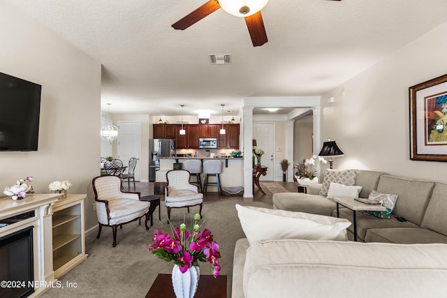 9831 Del Webb Pkwy Unit 2308, Jacksonville, FL 32256 - carpeted living area featuring a ceiling fan