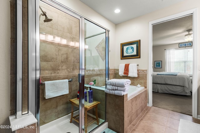 bathroom featuring ceiling fan, tile patterned flooring, and plus walk in shower